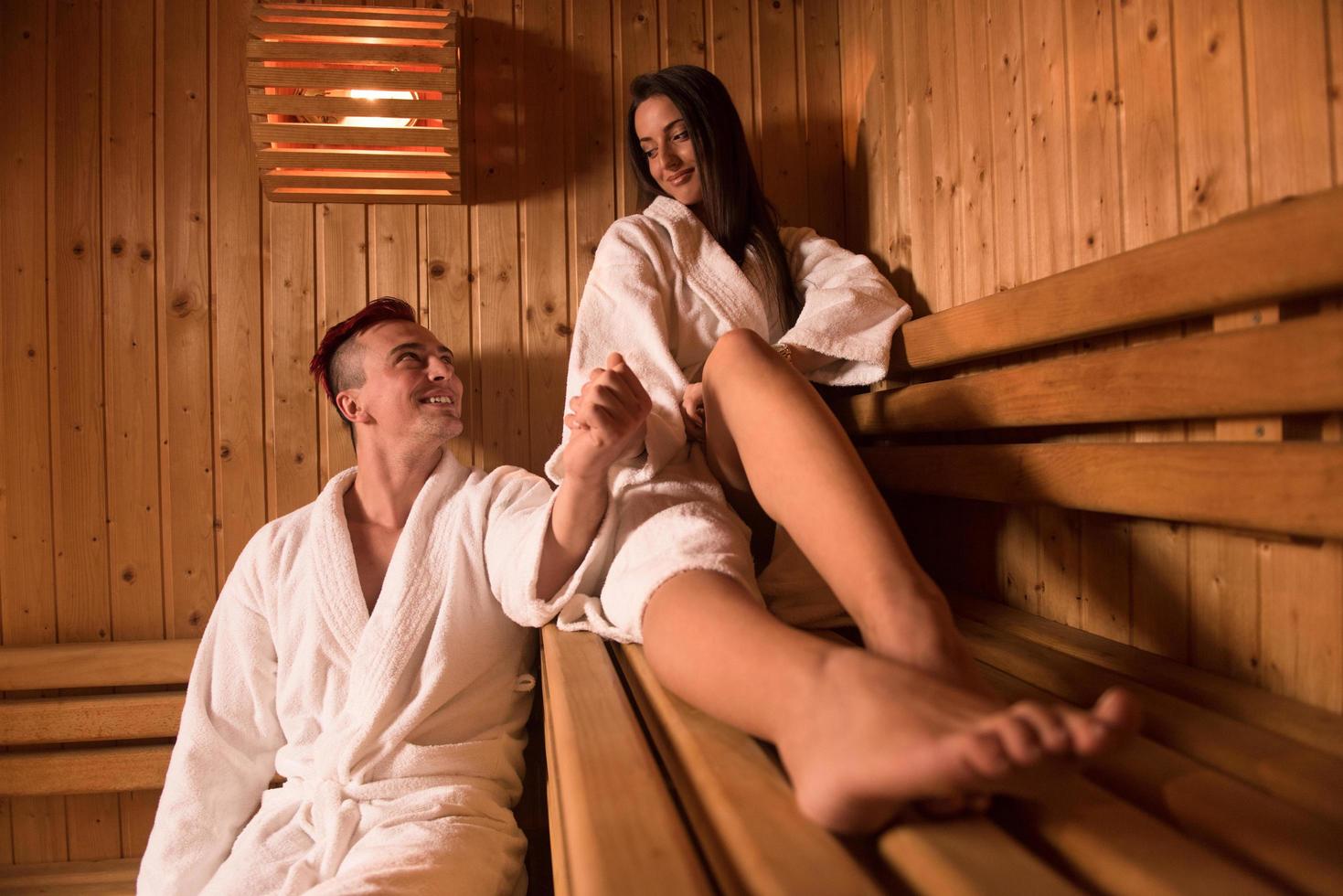 couple relaxing in the sauna photo