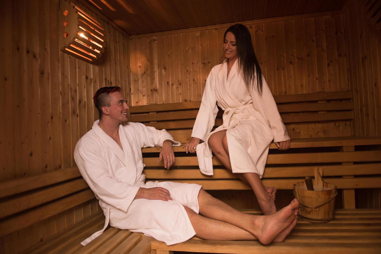 couple relaxing in the sauna photo