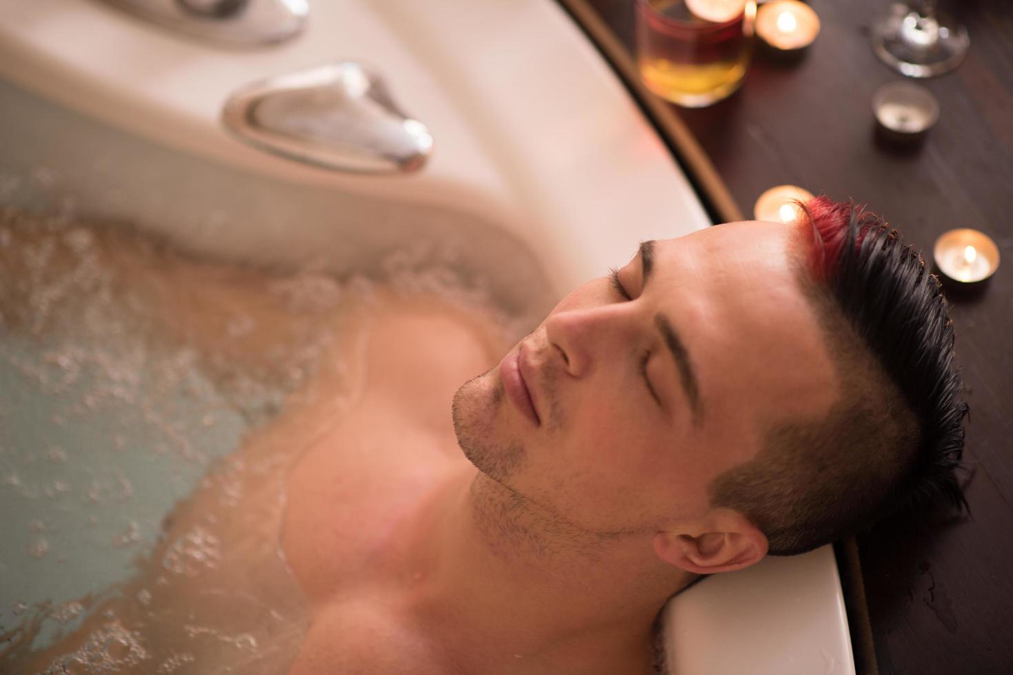 man relaxing in the jacuzzi photo