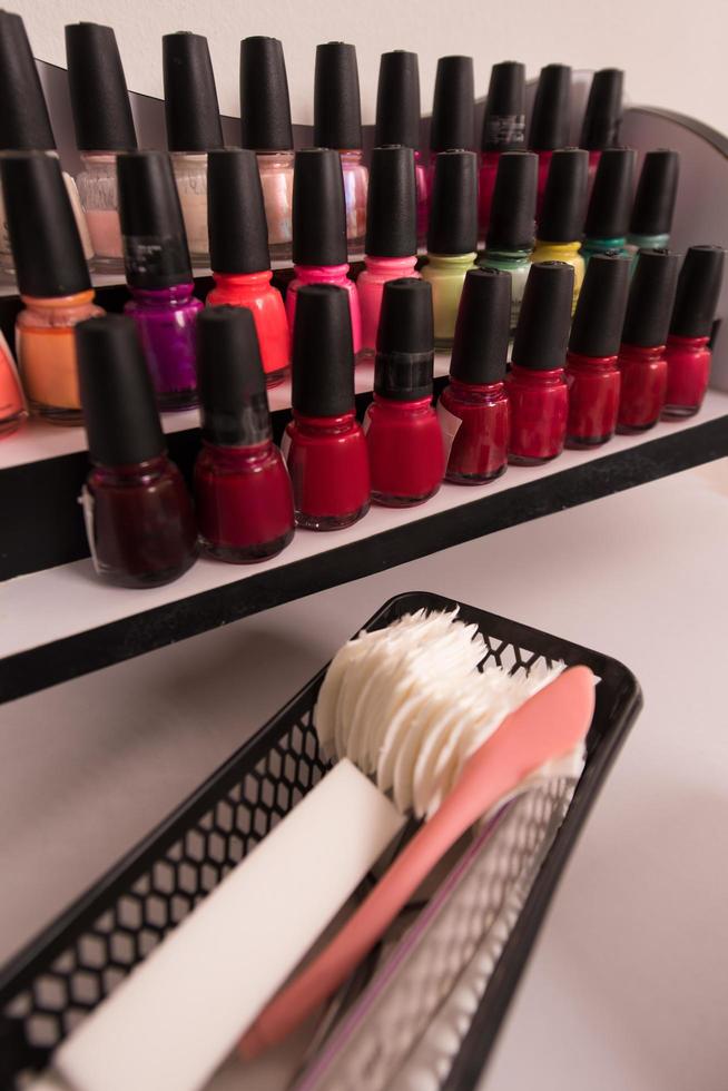 Set of different bottles of nail polish photo