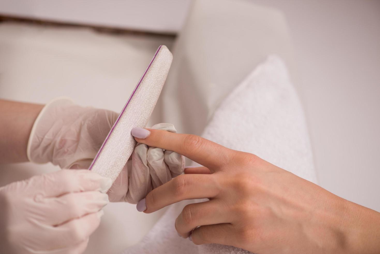 Woman hands receiving a manicure photo