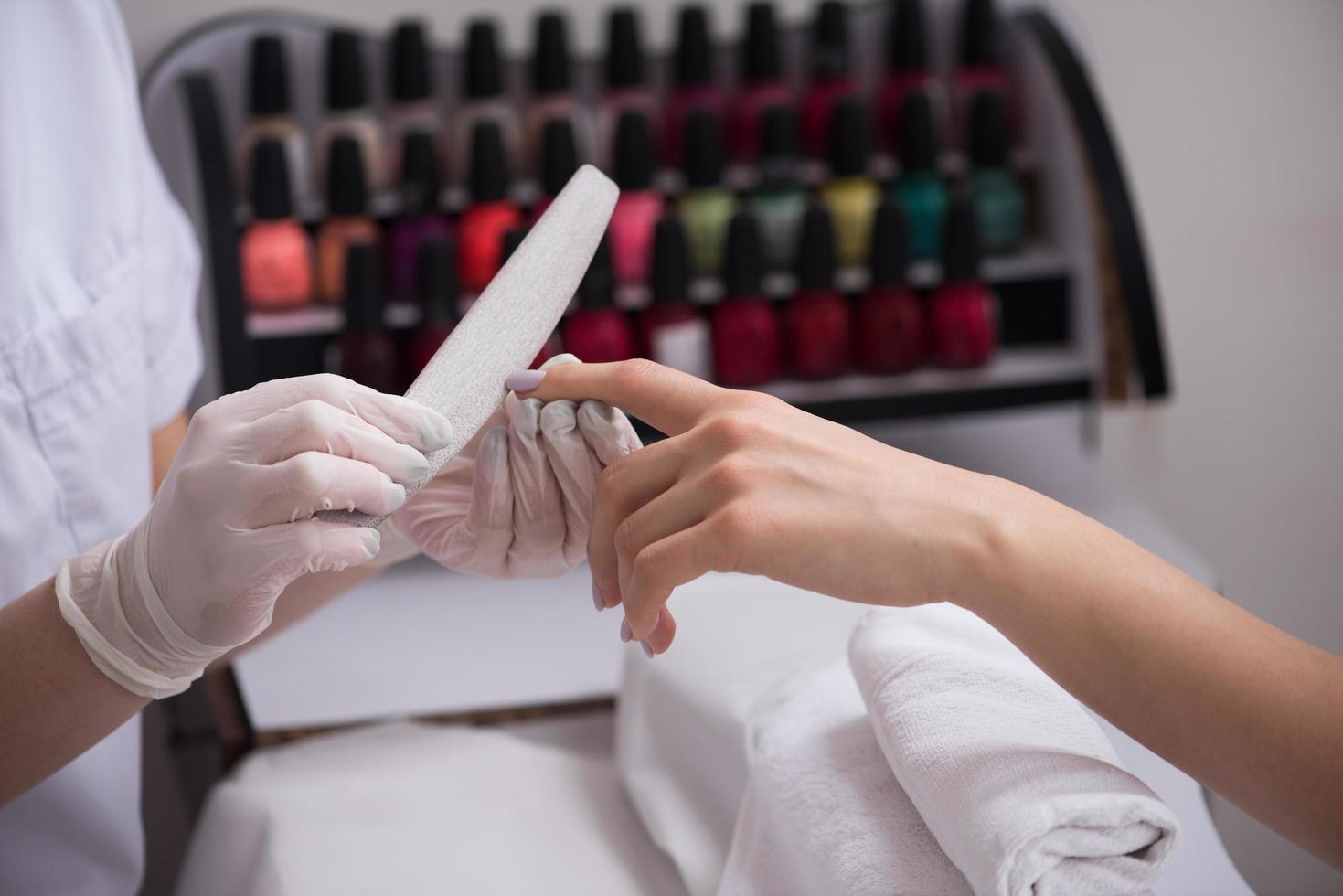 Woman hands receiving a manicure photo