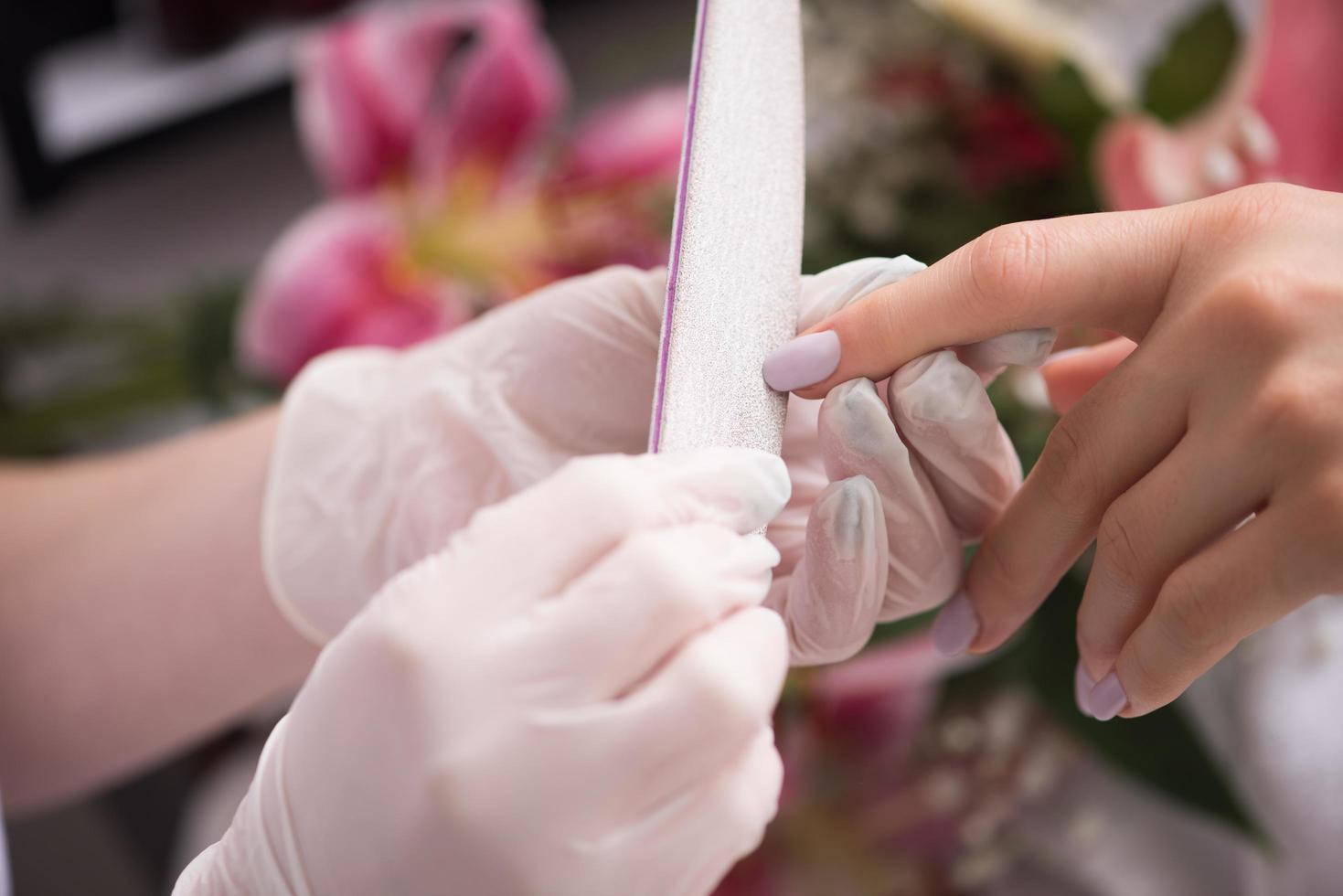 Woman hands receiving a manicure photo