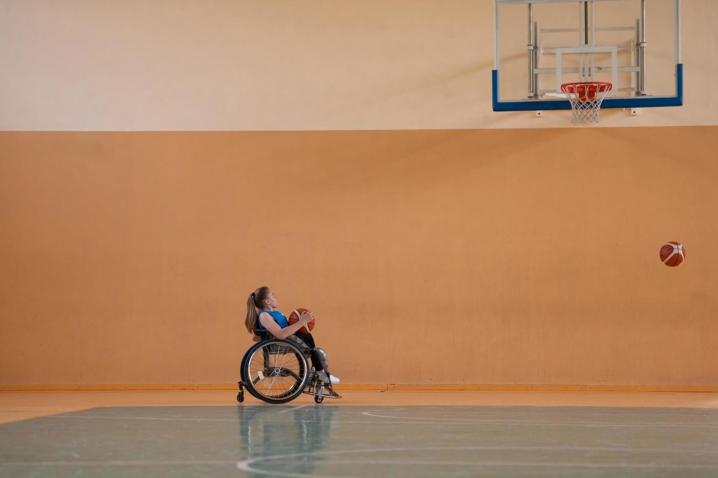 photo of the basketball team of war invalids with professional sports equipment for people with disabilities on the basketball court