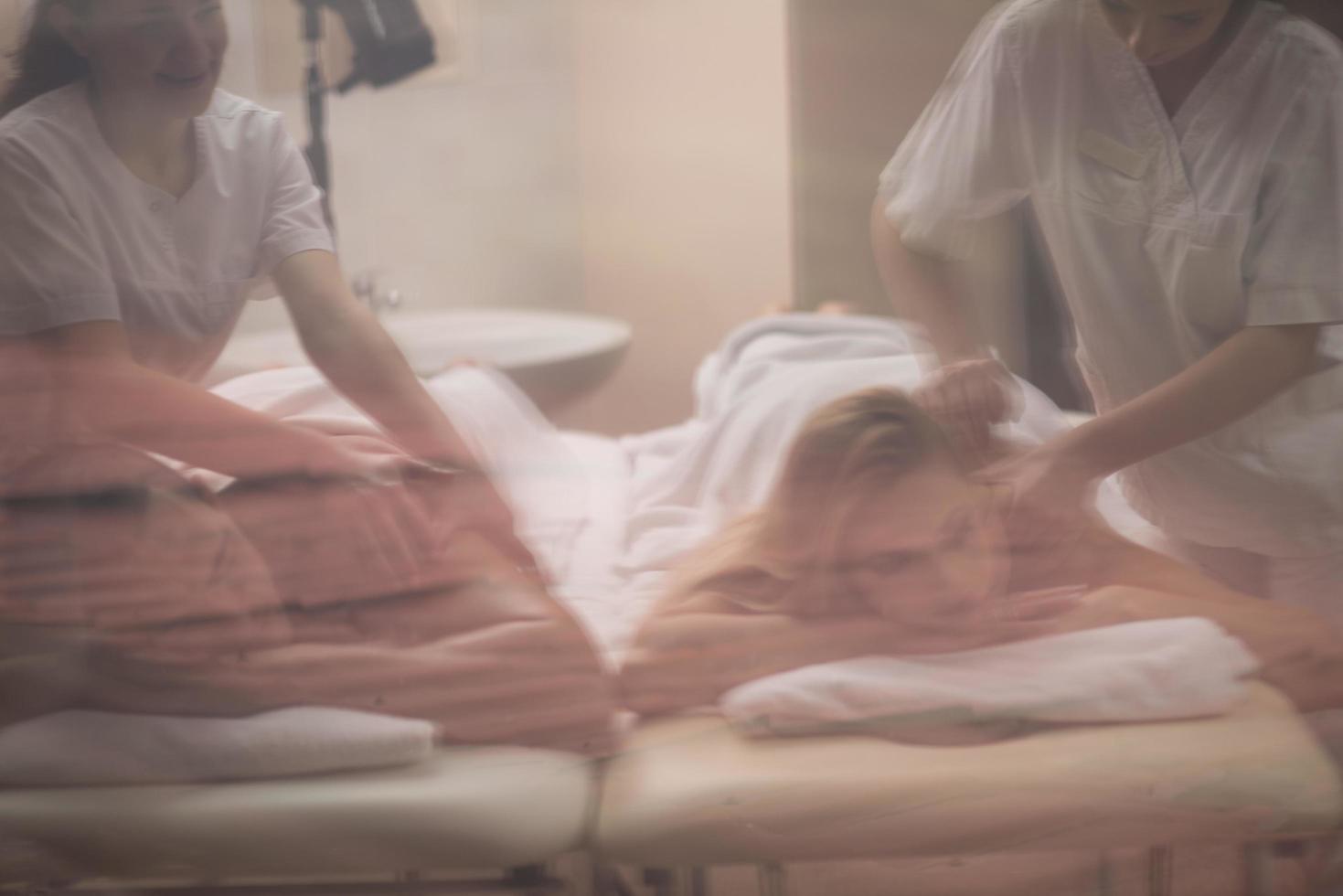 couple receiving a back massage photo