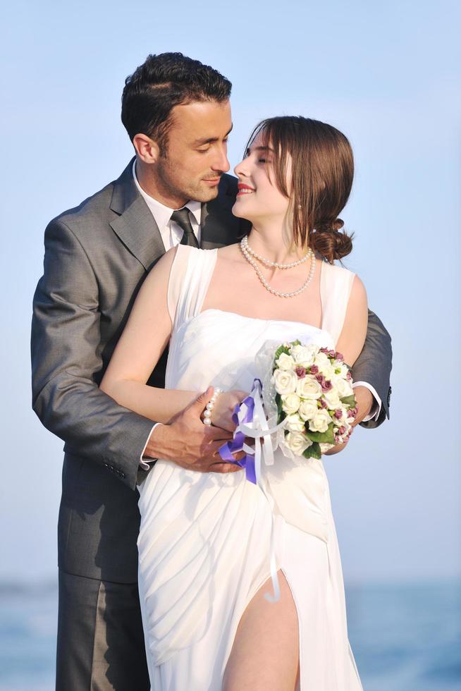 romantic beach wedding at sunset photo