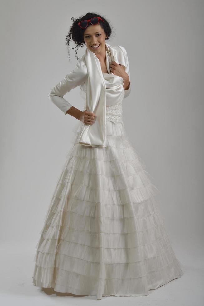elegant woman in fashionable dress posing in the studio photo