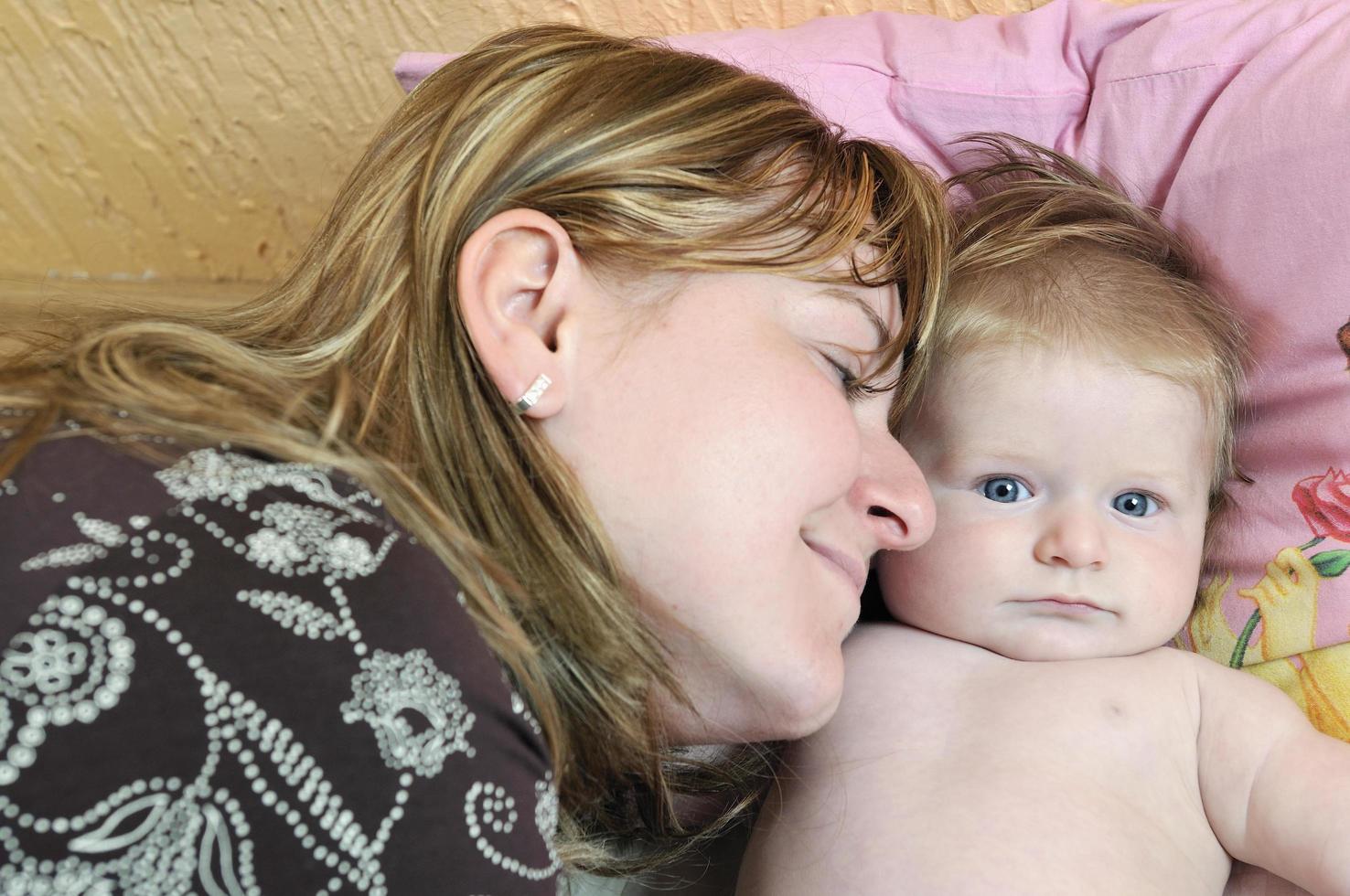 beautiful blonde young mother and cute baby photo