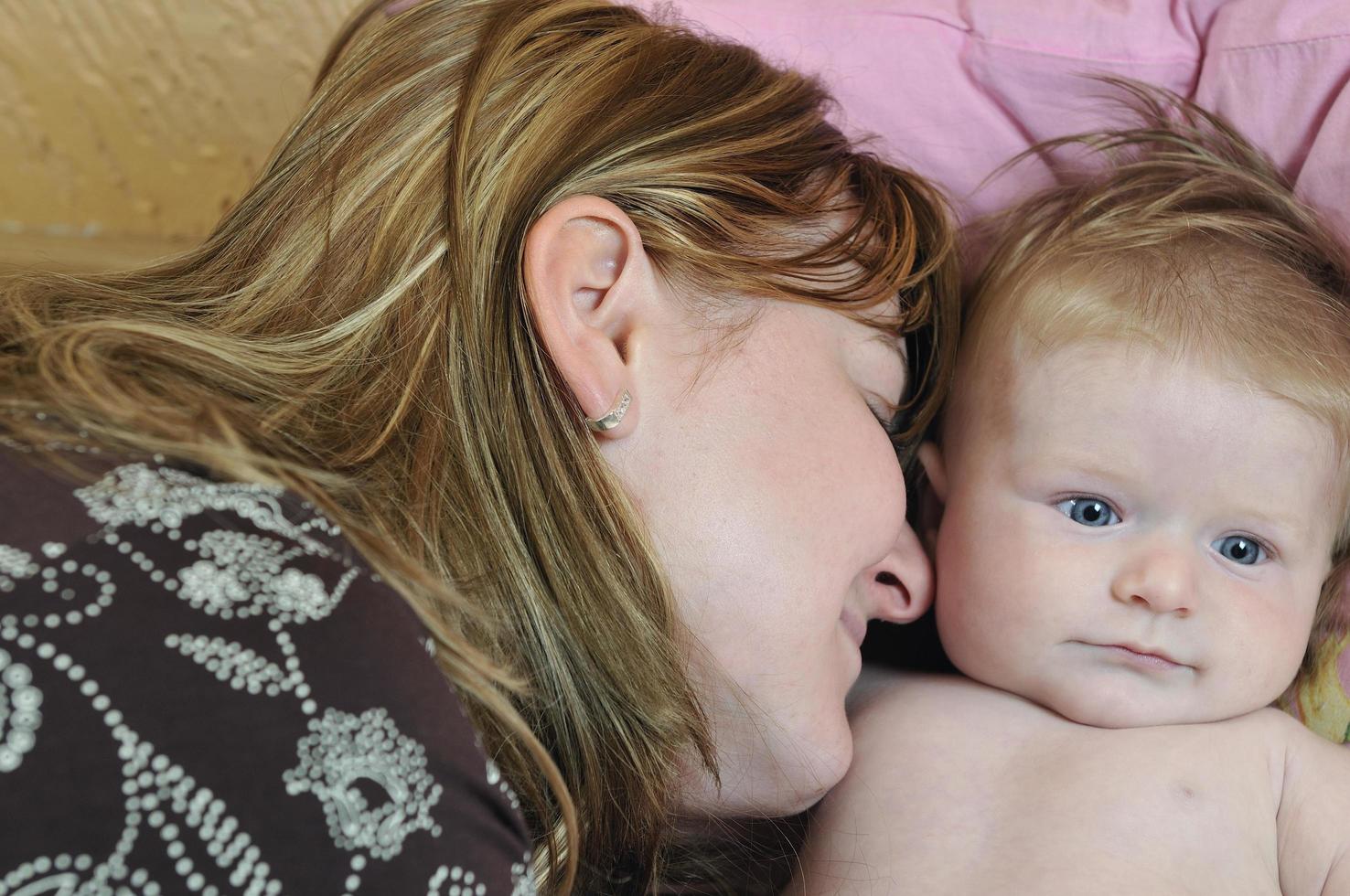 beautiful blonde young mother and cute baby photo