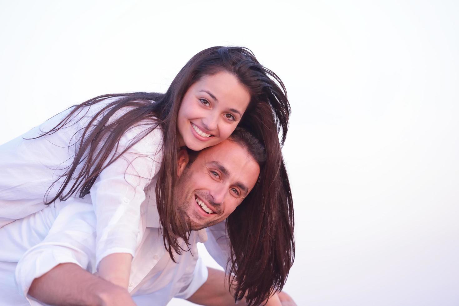 young couple  on beach have fun photo