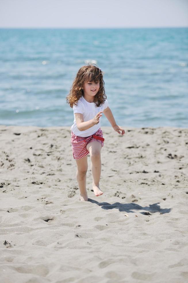 little female  child portrait on the beach photo