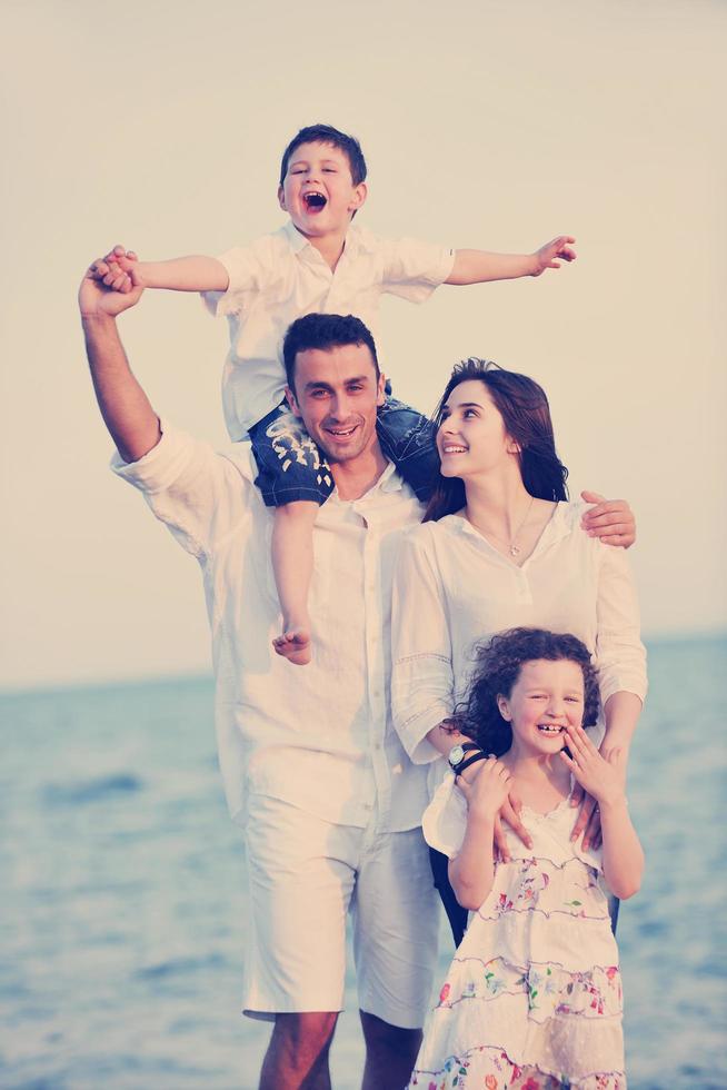 happy young family have fun on beach photo