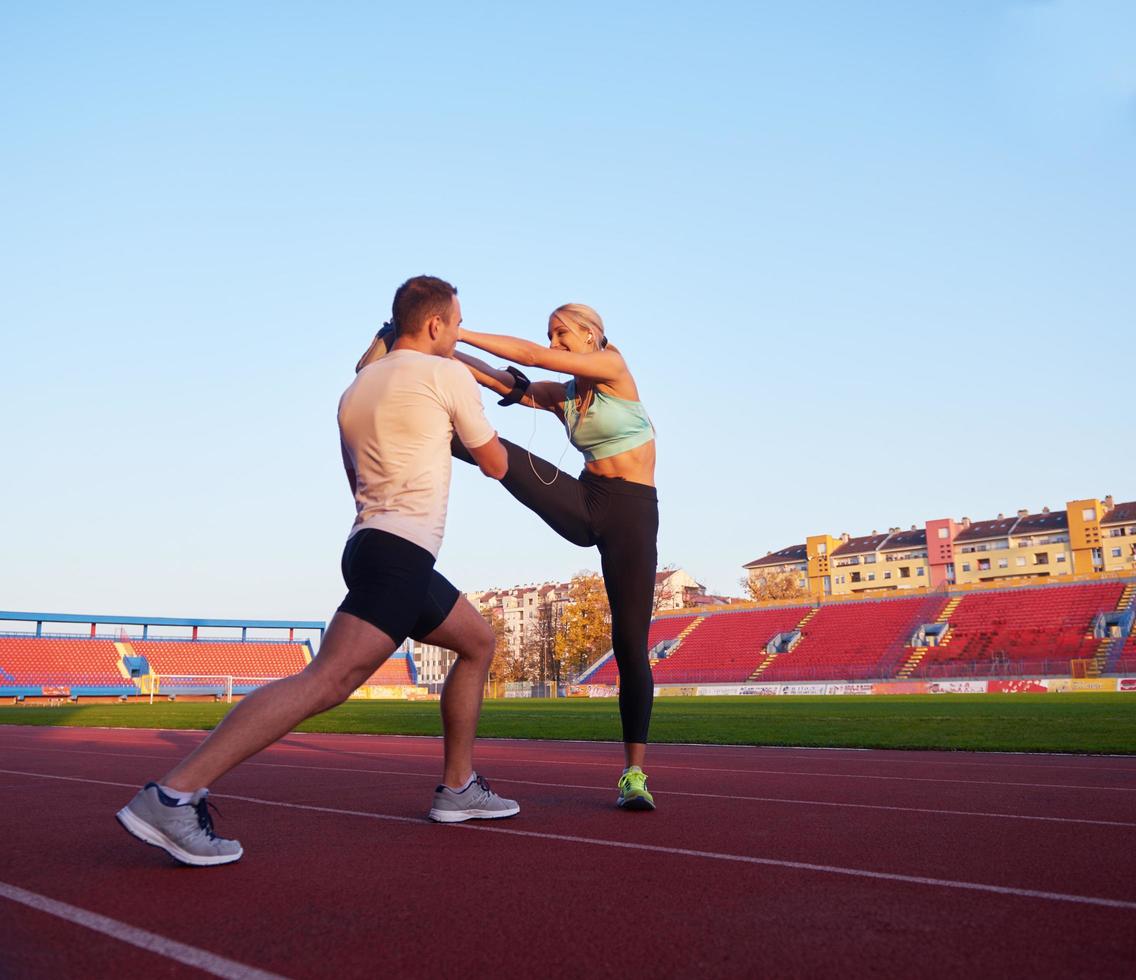 sporty woman on athletic race track photo