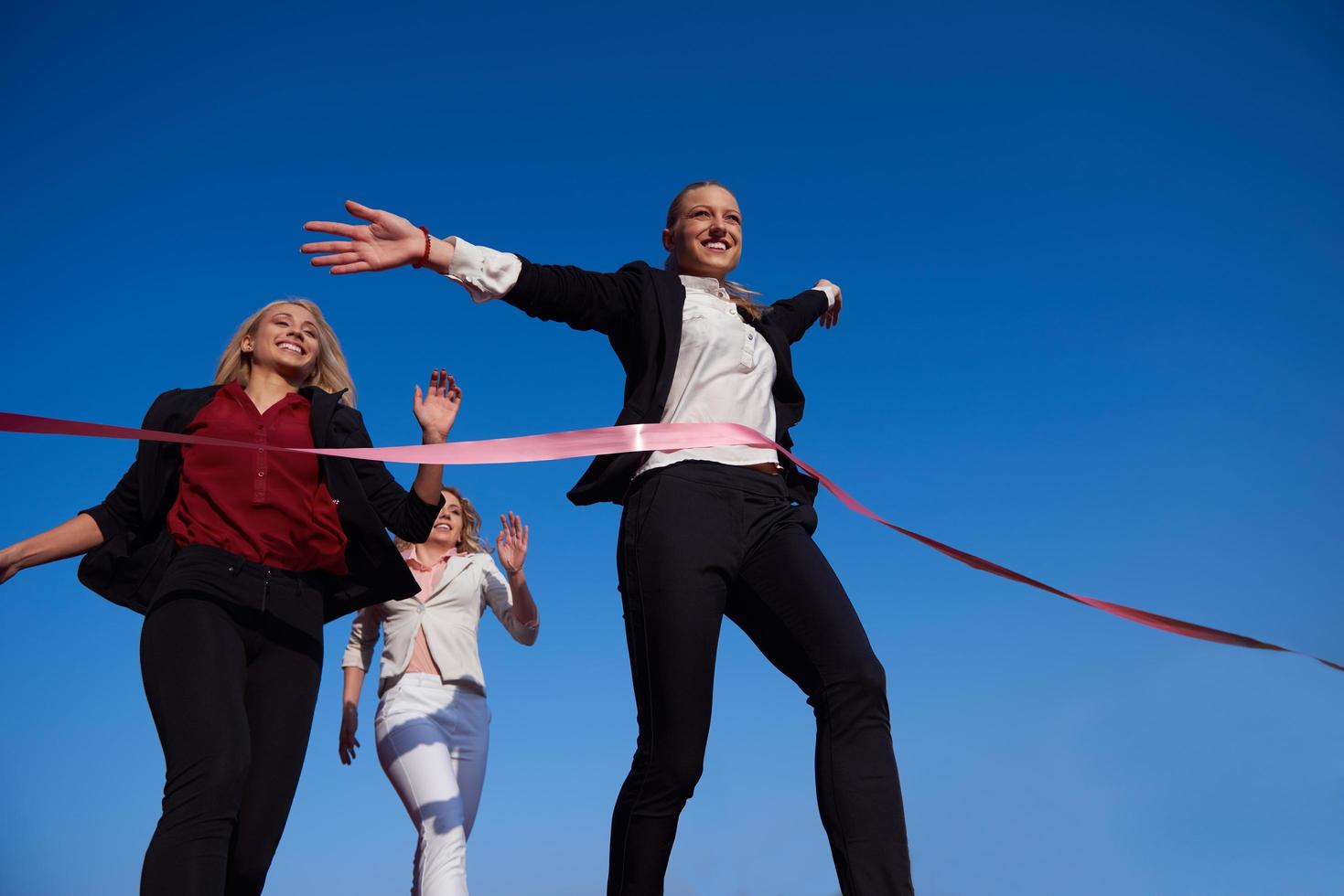 business people running on racing track photo