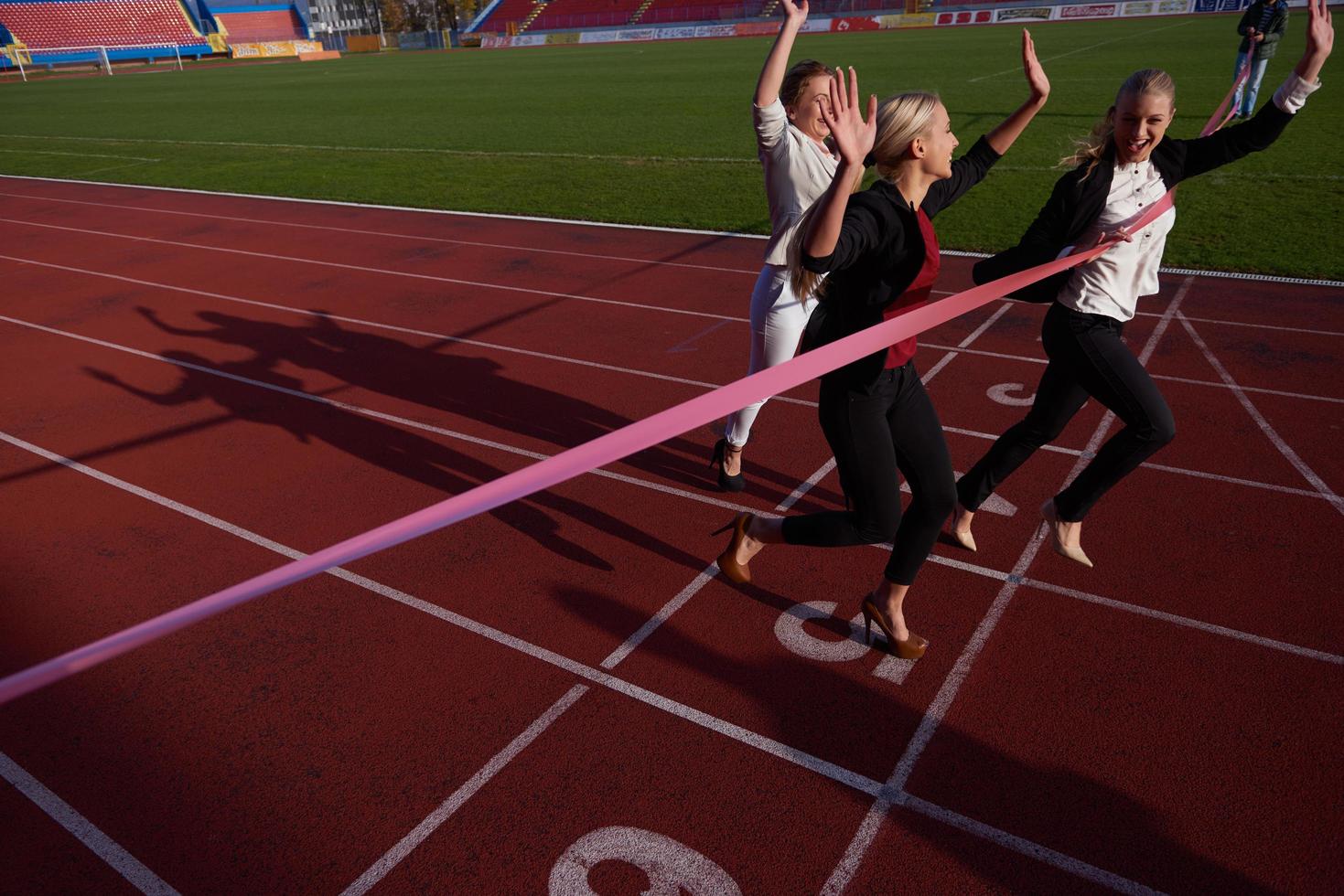 business people running on racing track photo