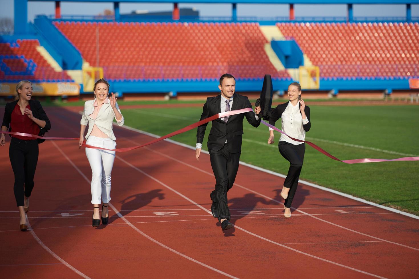 business people running on racing track photo