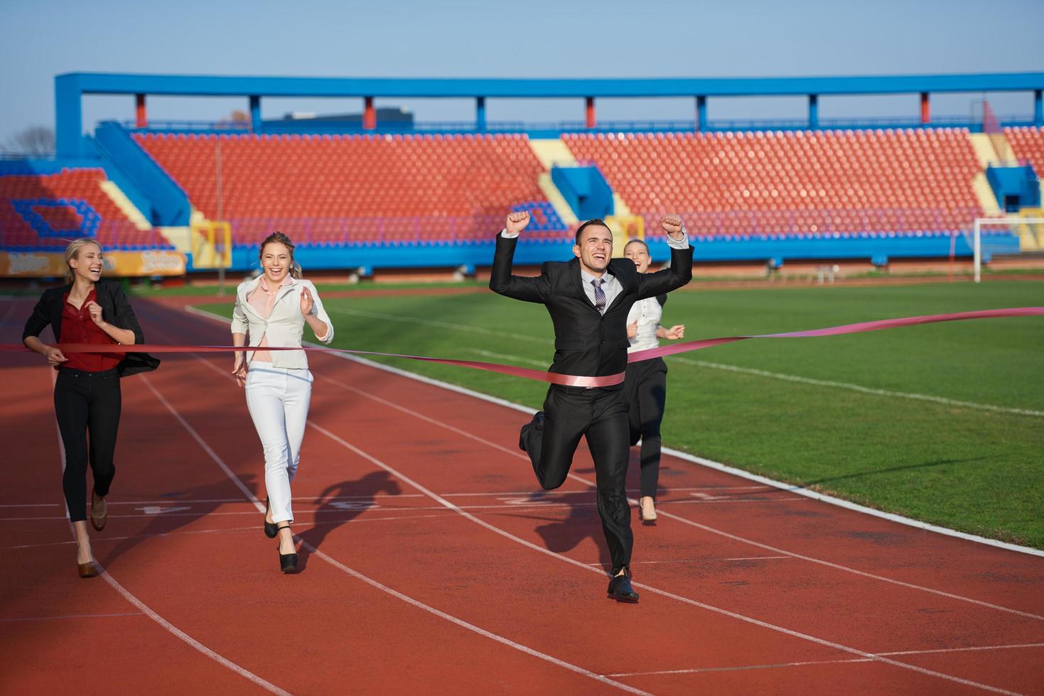business people running on racing track photo