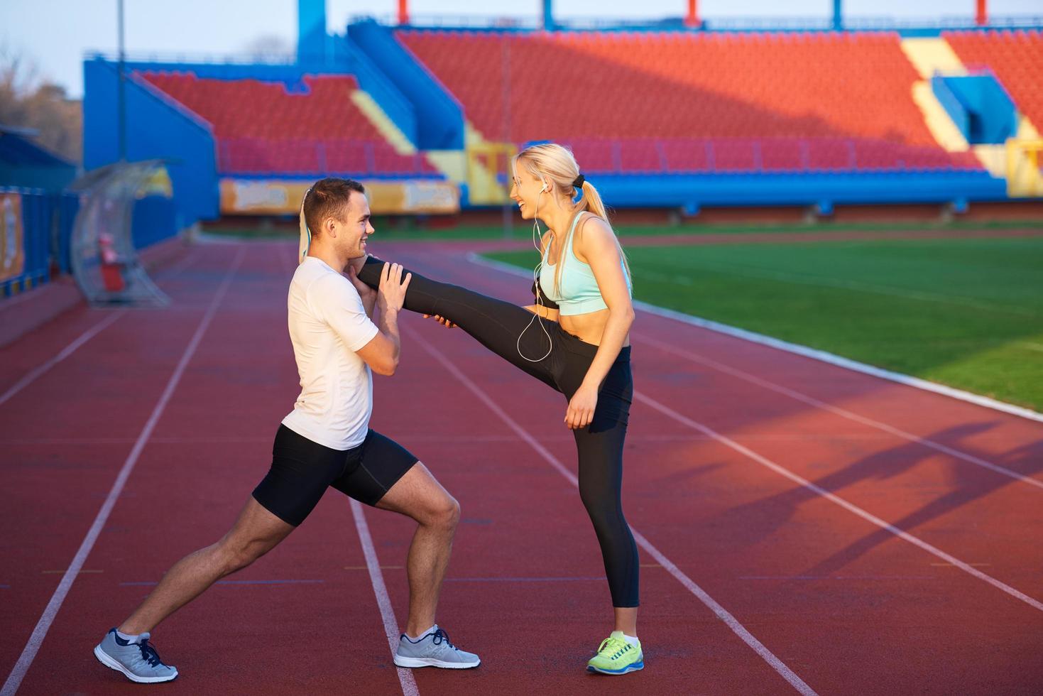 sporty woman on athletic race track photo