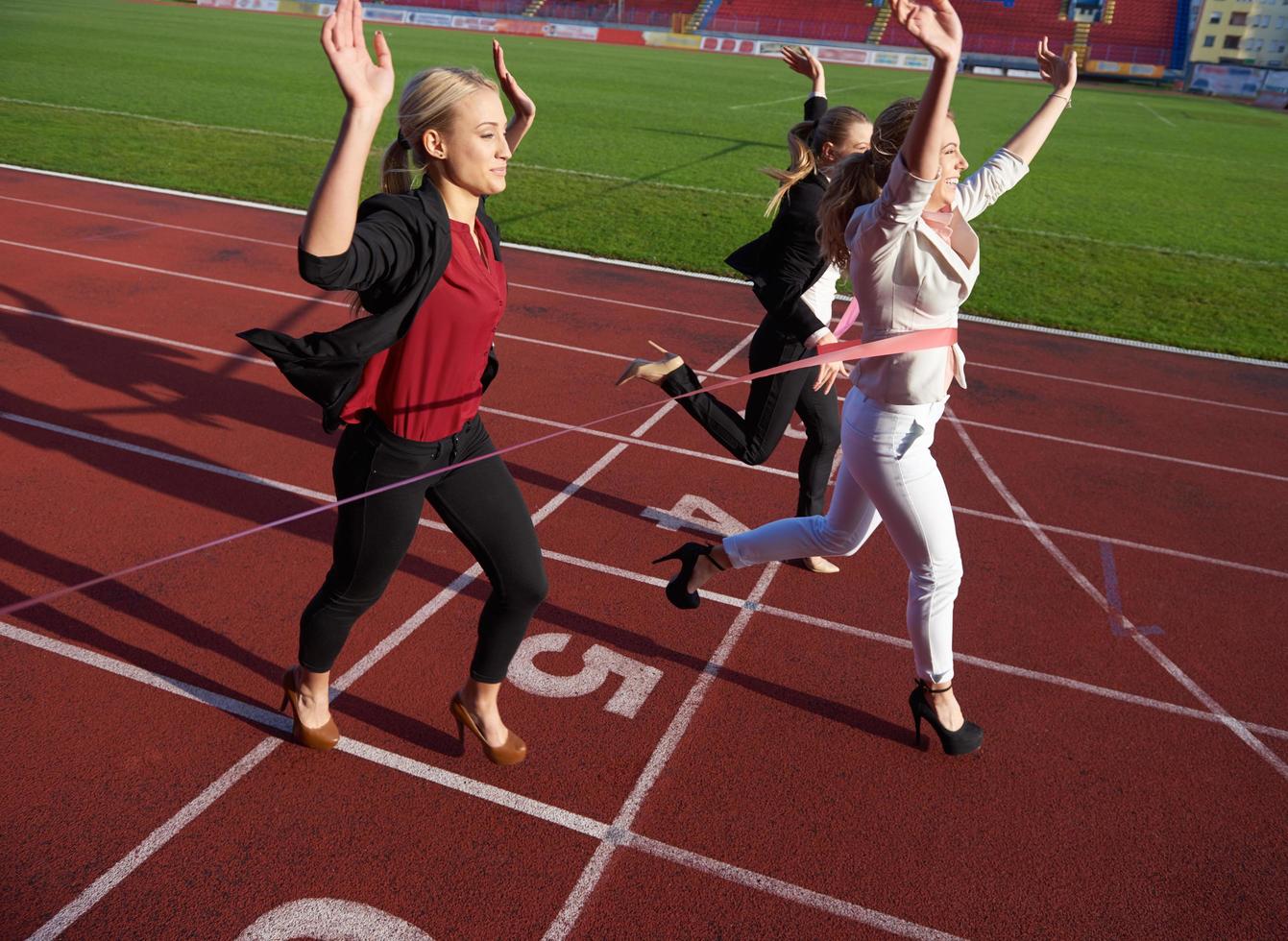 business people running on racing track photo