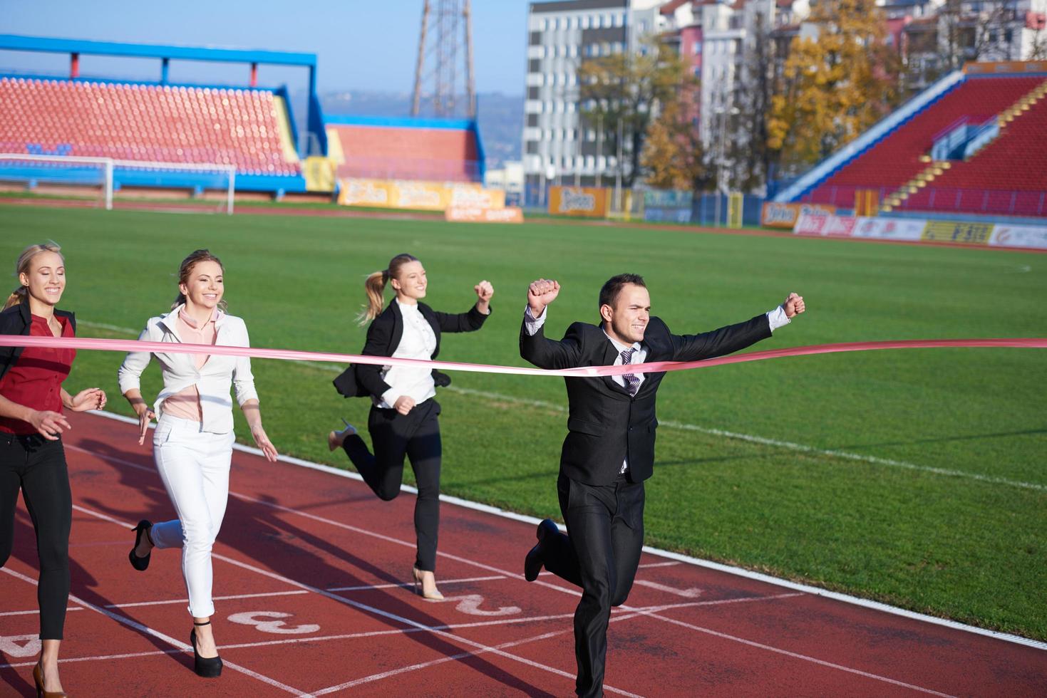 business people running on racing track photo