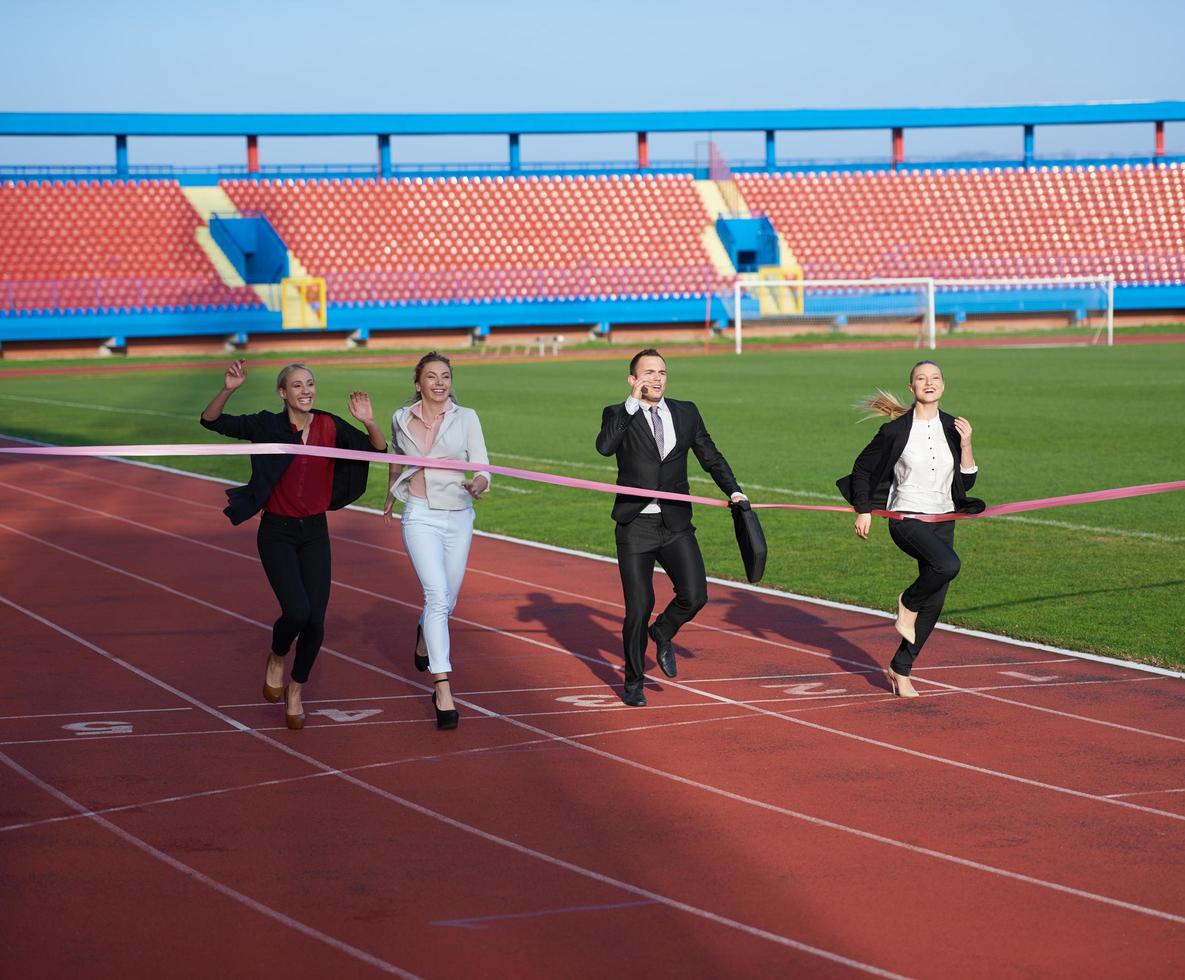 business people running on racing track photo