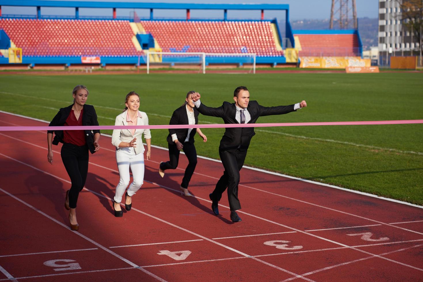 business people running on racing track photo