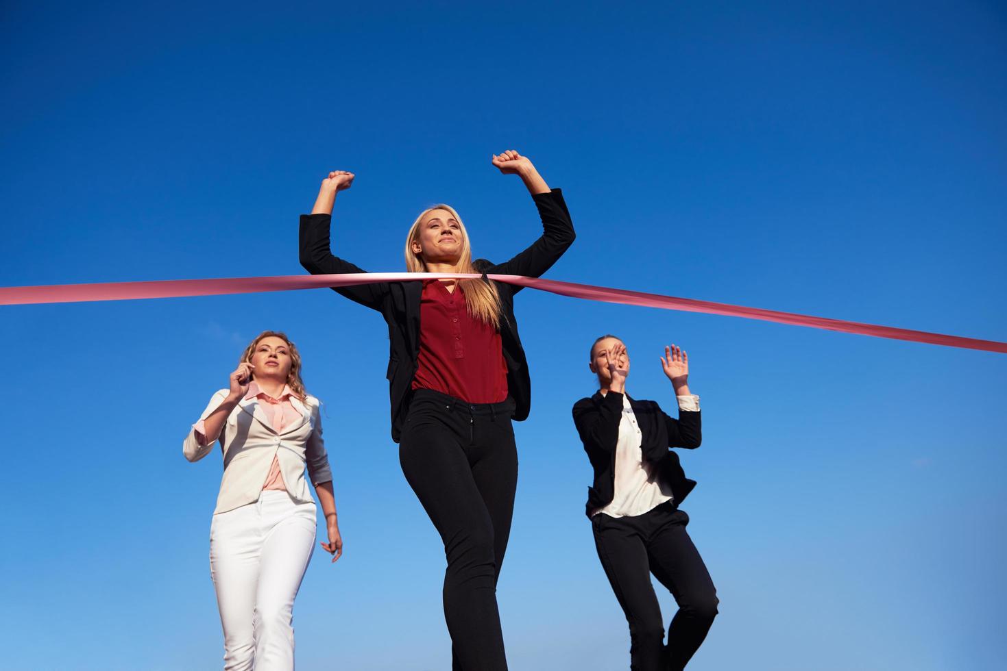 business people running on racing track photo