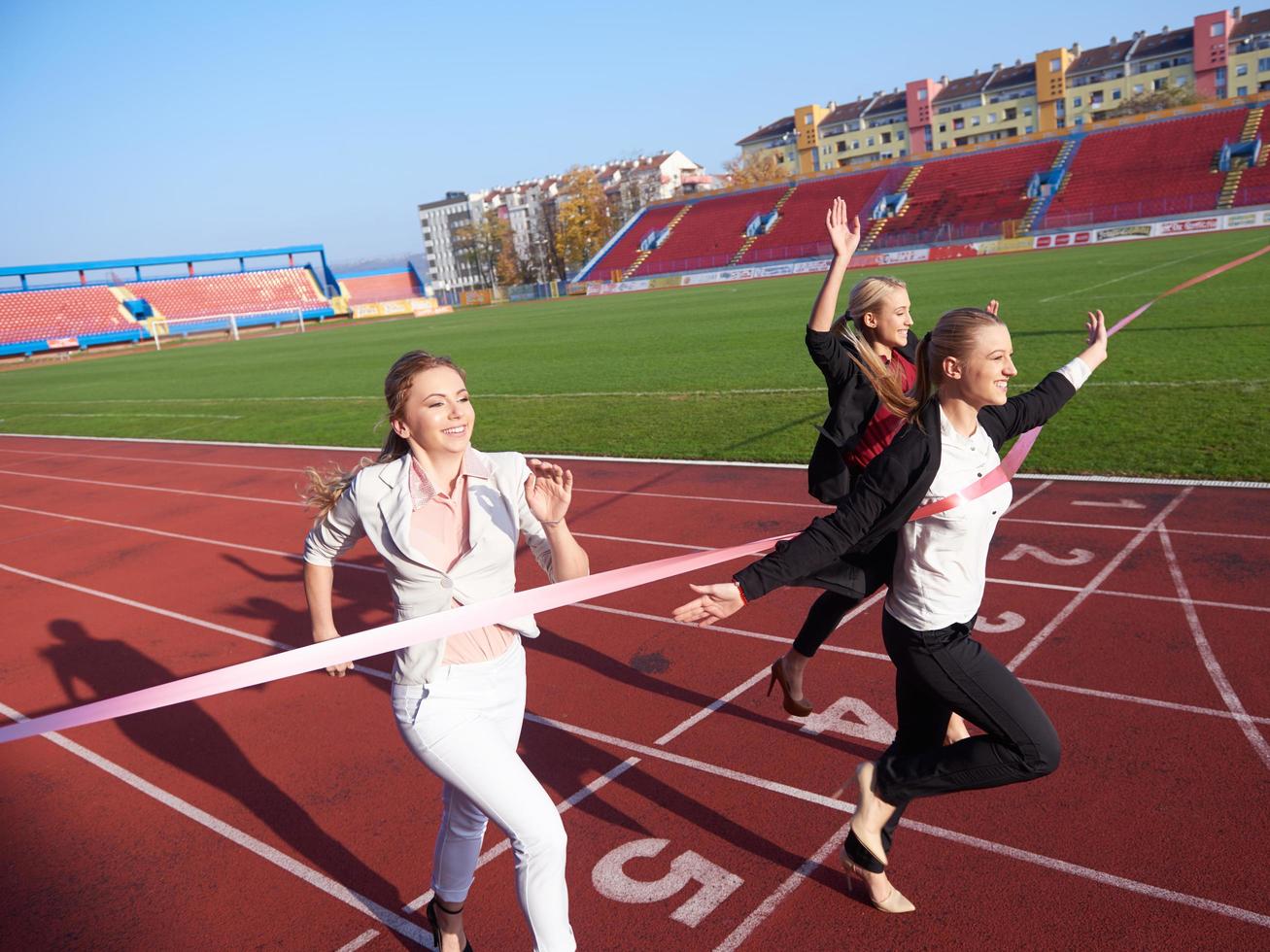 business people running on racing track photo