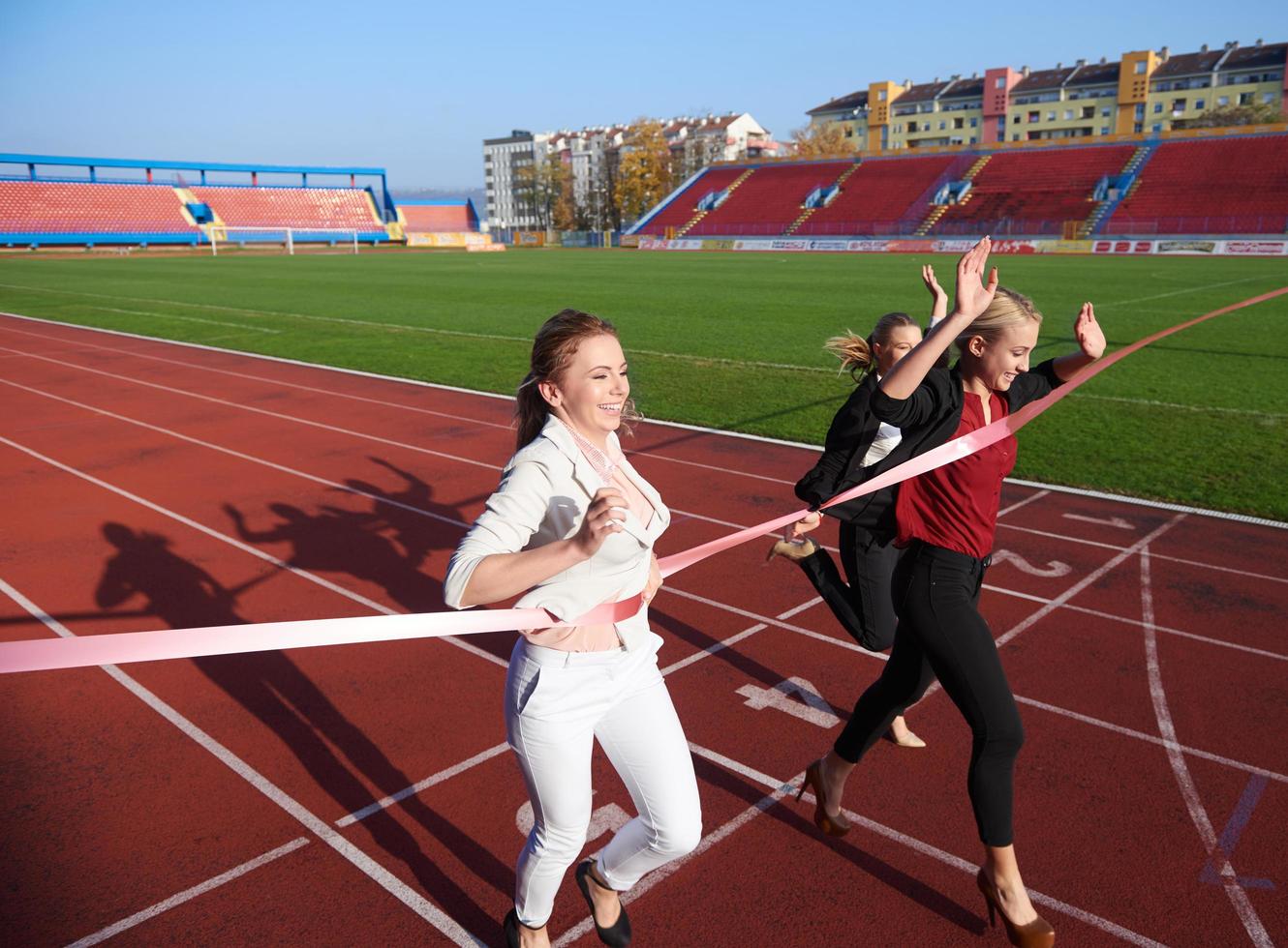 business people running on racing track photo