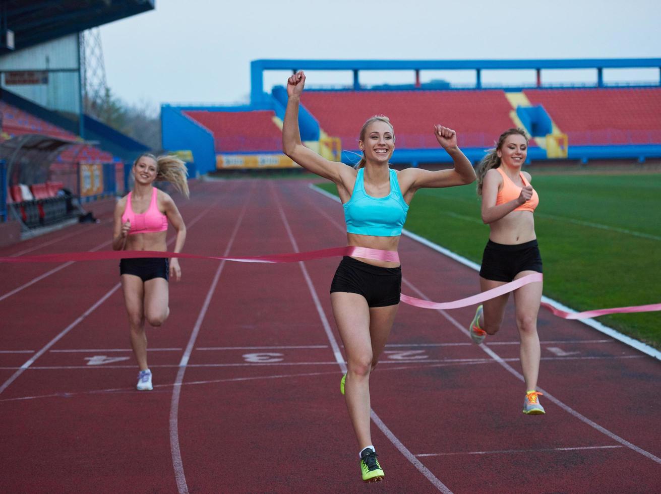 Female Runners Finishing Race Together photo