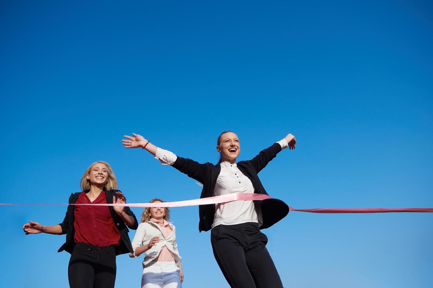 business people running on racing track photo