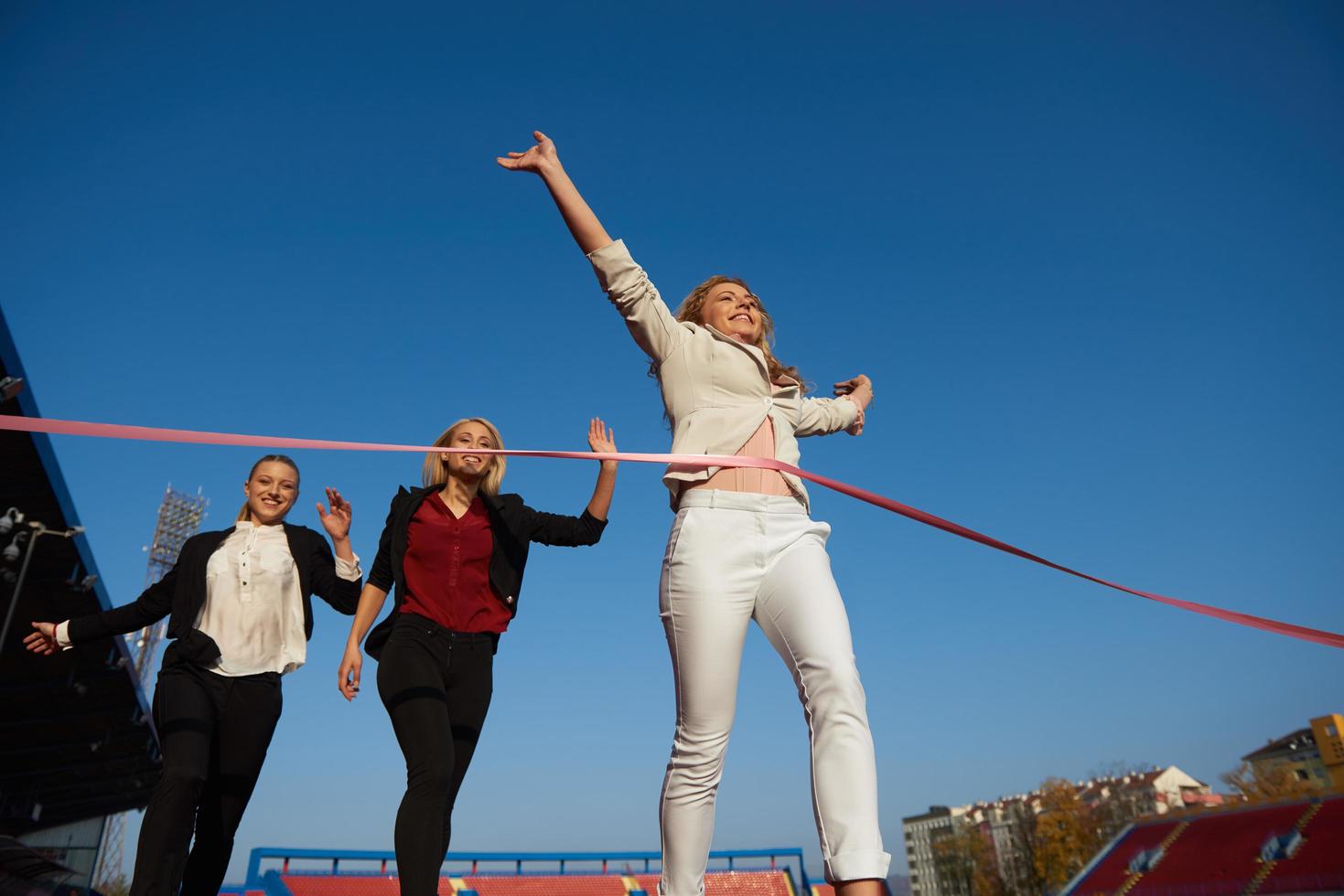 business people running on racing track photo