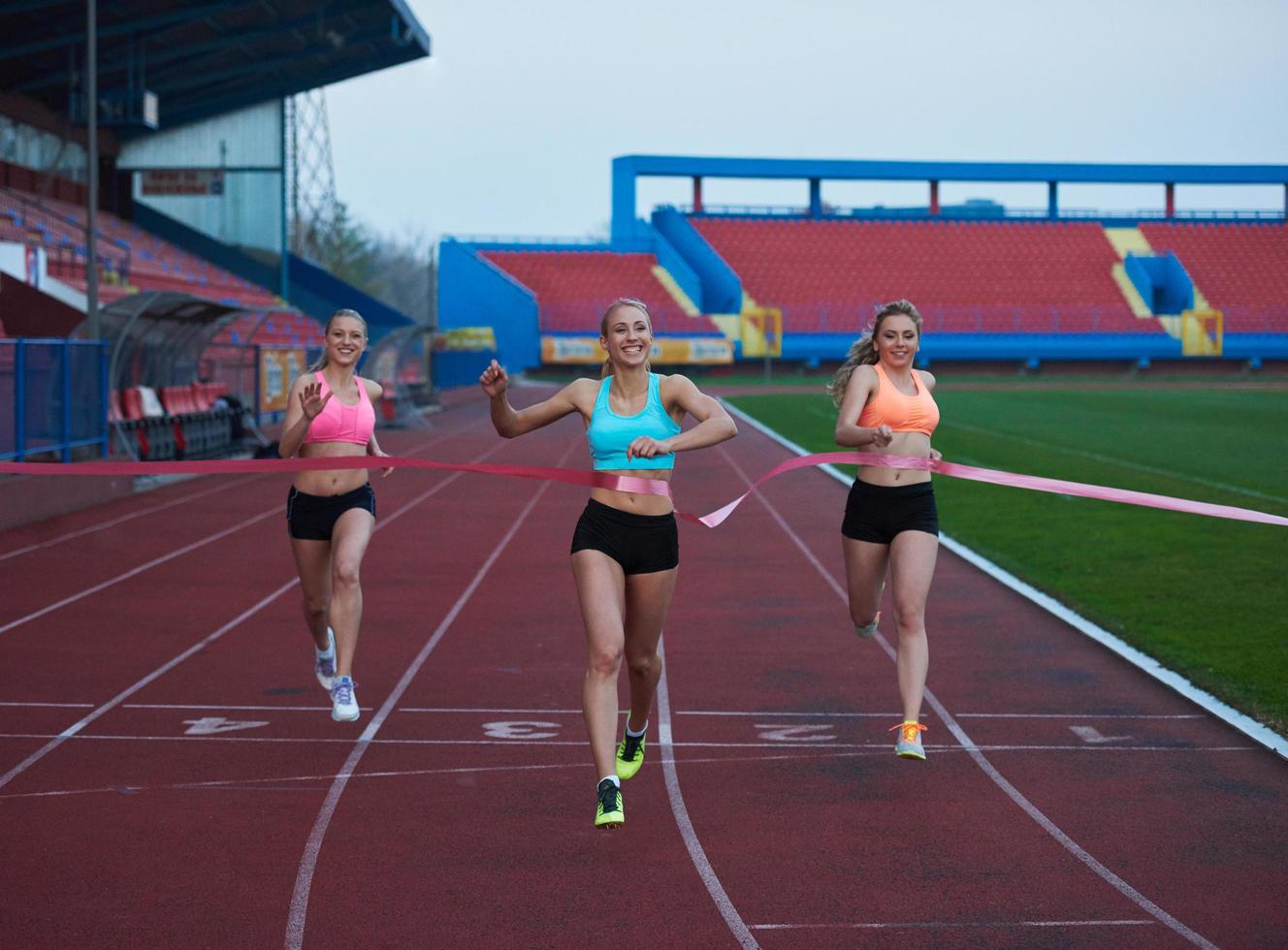 Female Runners Finishing Race Together photo