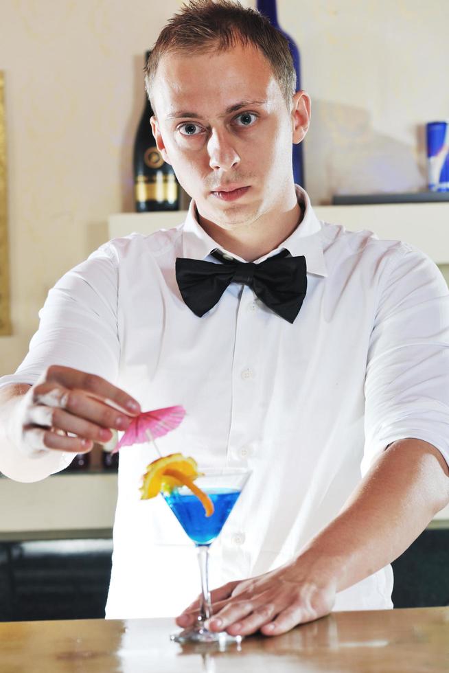 pro barman prepare coctail drink on party photo