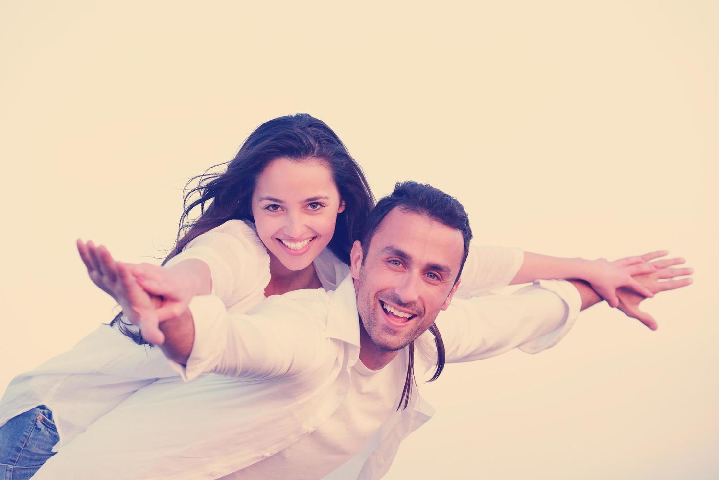 young couple  on beach have fun photo