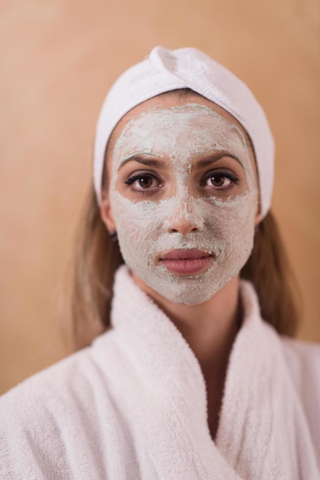 Spa Woman applying Facial Mask photo