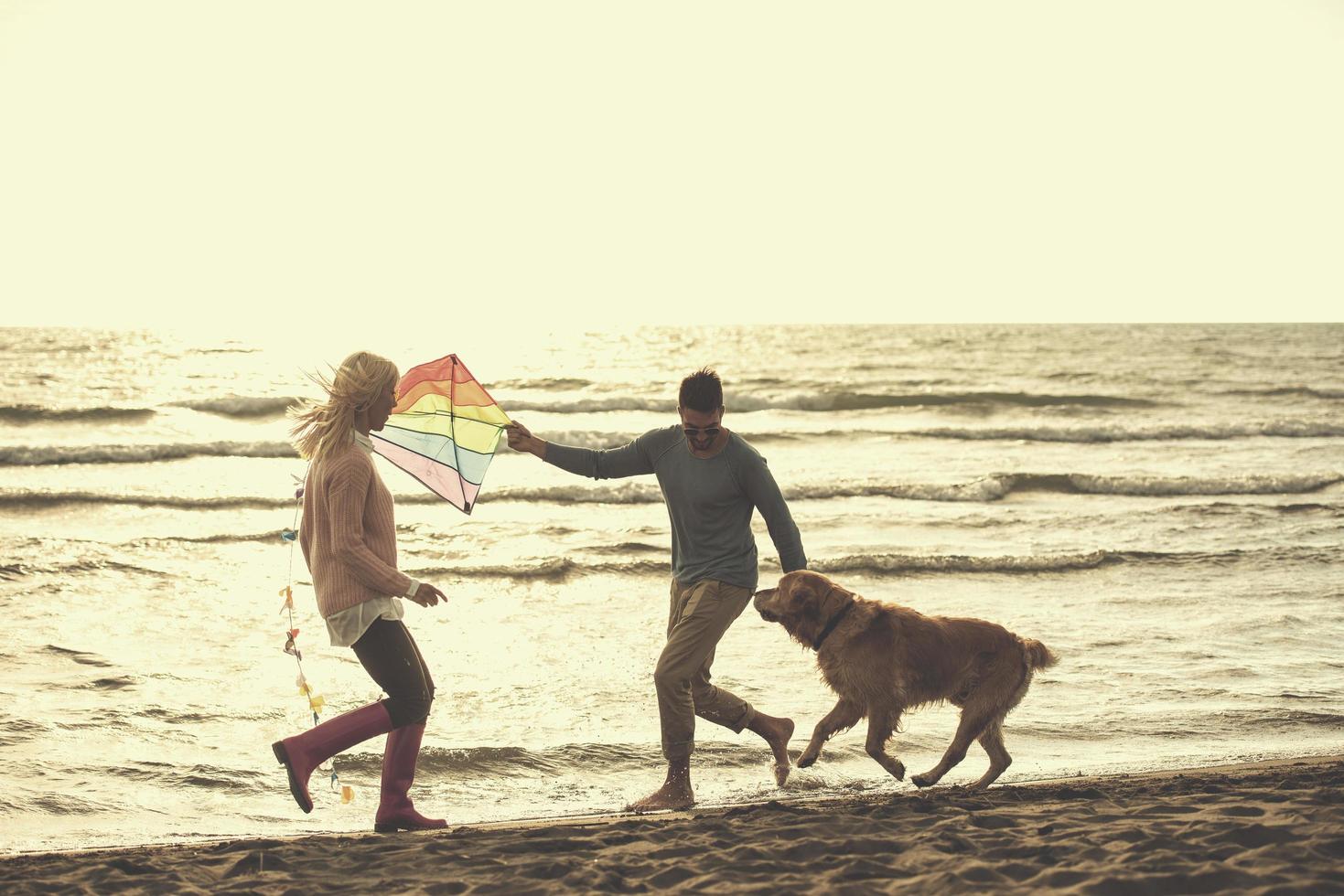 happy couple enjoying time together at beach photo