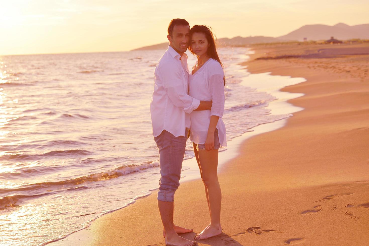 young couple  on beach have fun photo