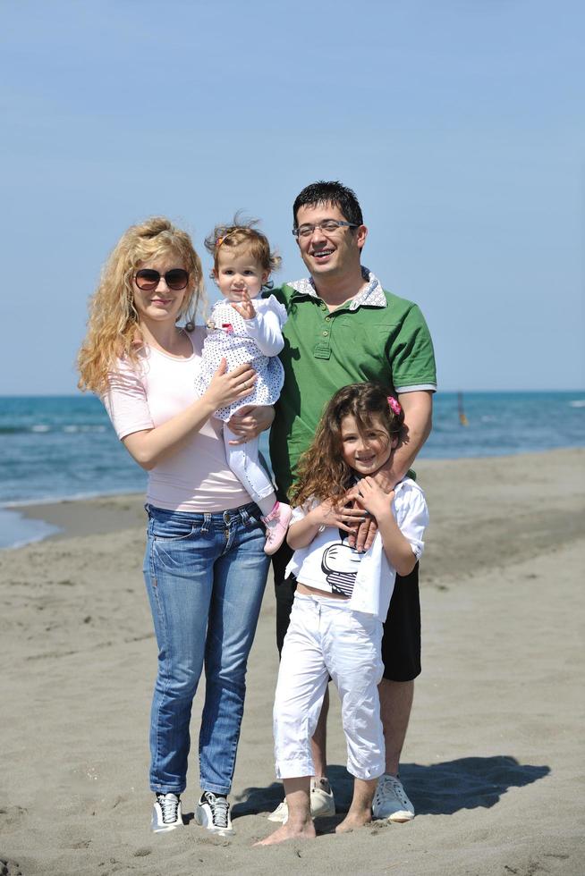 happy young family have fun on beach photo