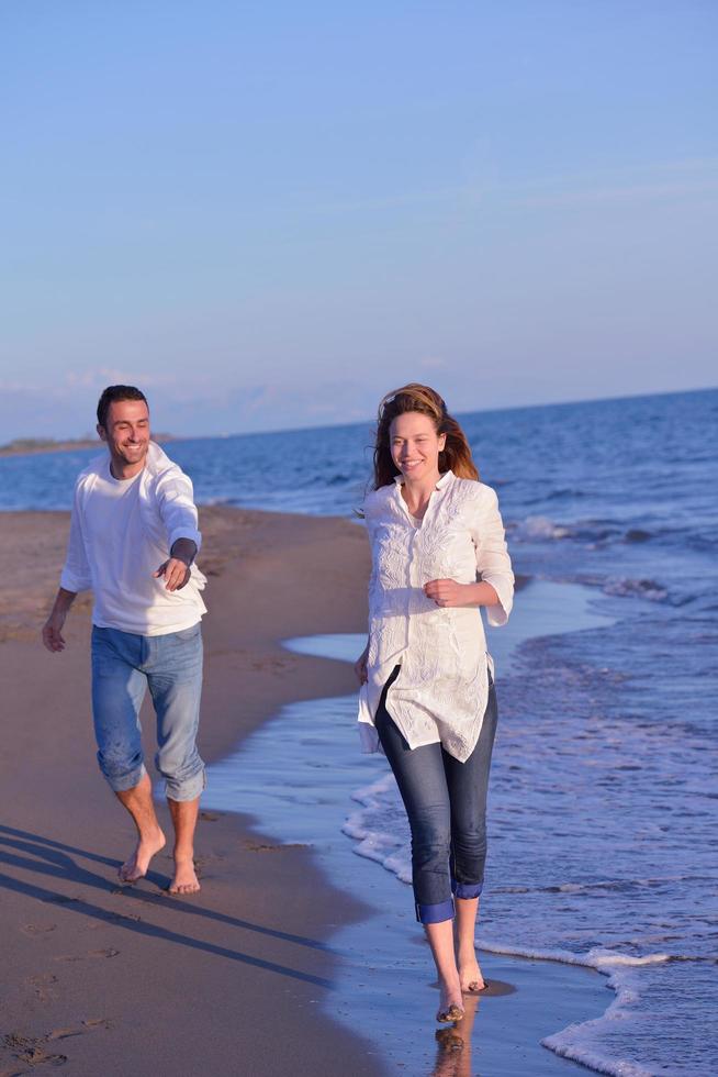 young couple  on beach have fun photo