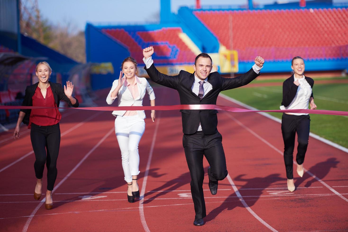 business people running on racing track photo