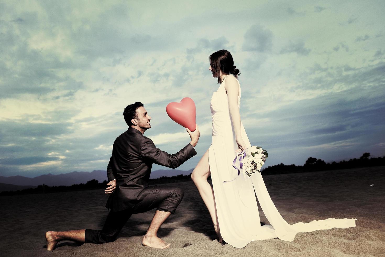 romantic beach wedding at sunset photo