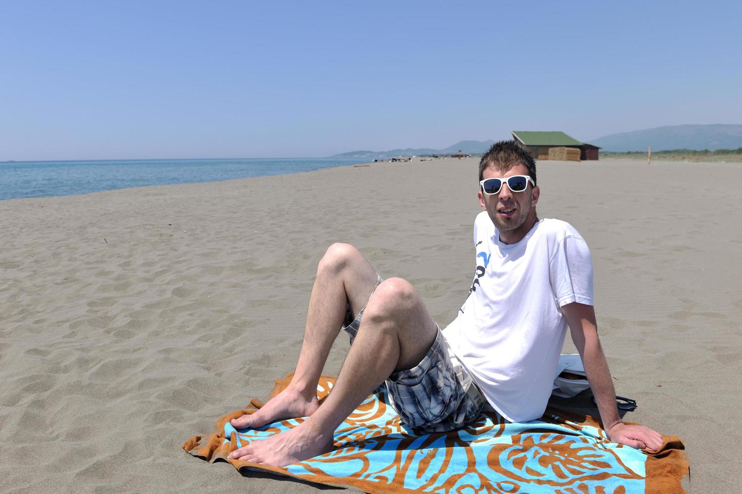 man relax on beach photo