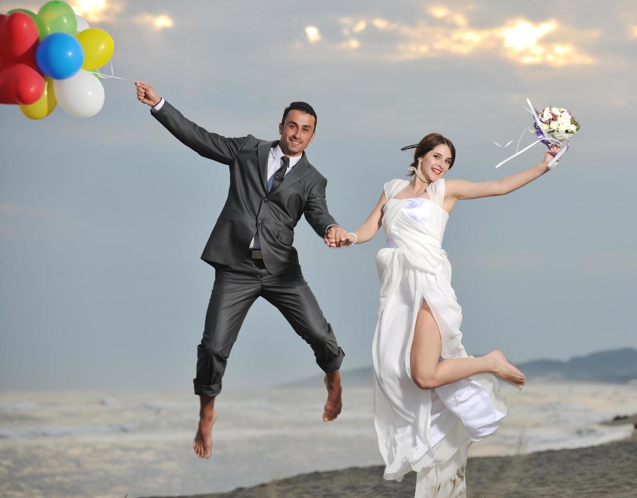 romantic beach wedding at sunset photo