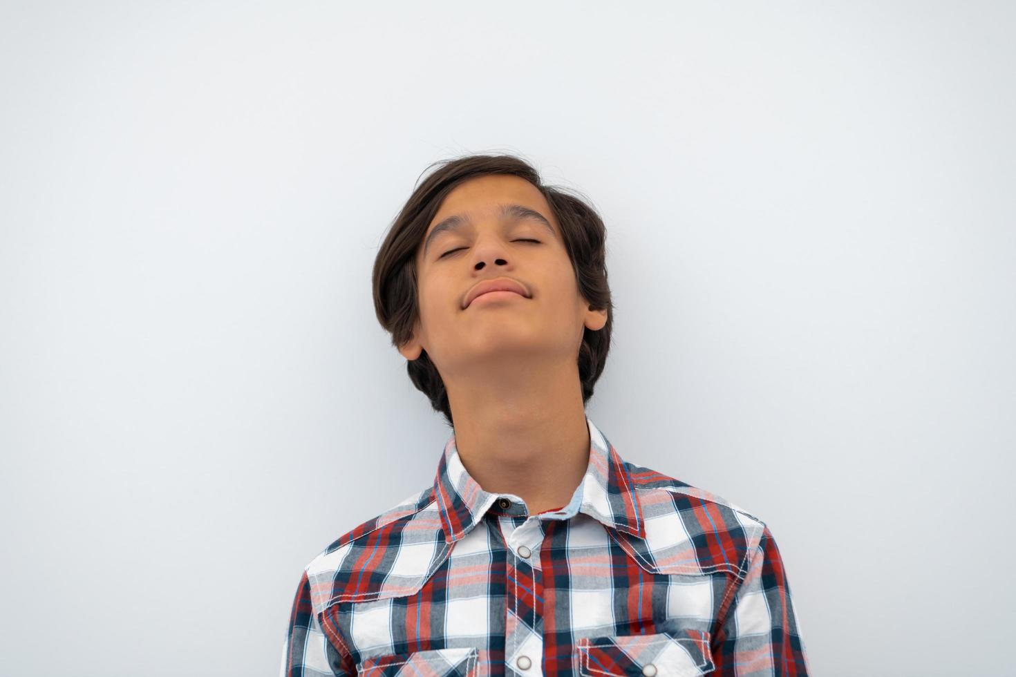 a portrait of a young attractive Arab boy isolated on a white background photo