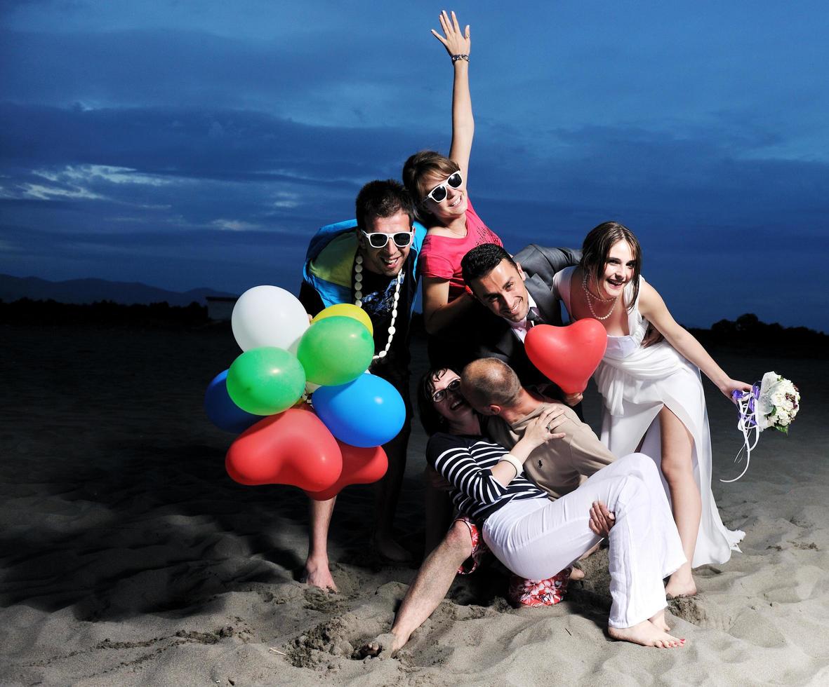 happy young  people group have fun on beach photo