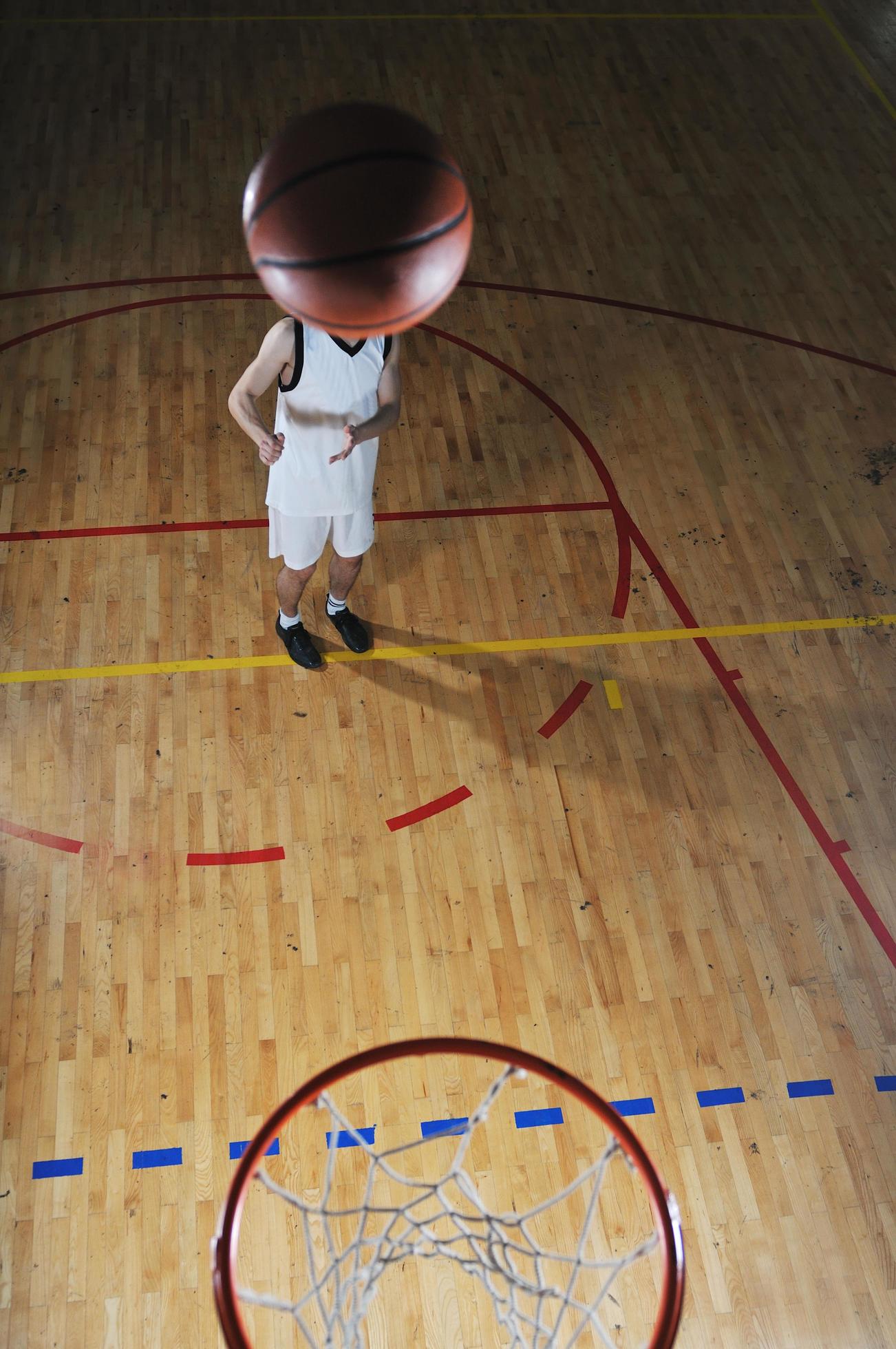 basket ball game player at sport hall 12654011 Stock Photo at Vecteezy