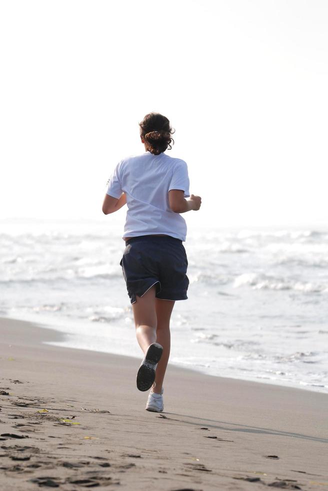 Runner on beach photo