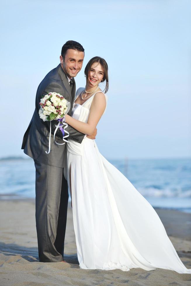 romantic beach wedding at sunset photo