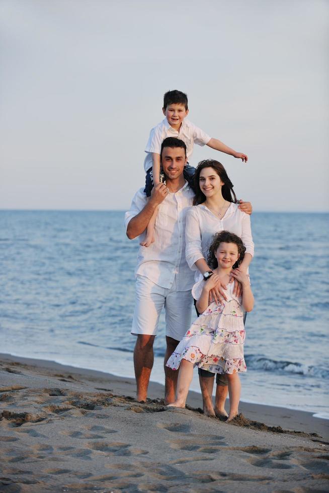 happy young family have fun on beach photo
